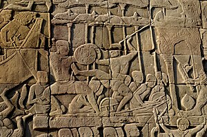Two martial artists sparring in ancient Cambodia as depicted at the Bayon temple Angkor Wat.- Battle of Devas and Asuras (4).jpg