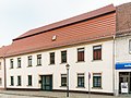 Ackerbürgerhaus in geschlossener Bebauung und winklig anschließendes Nebengebäude mit Laubengang