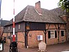 Grenslandmuseum, boerderij met dwars woongedeelte onder schilddak en met in de verdieping nog de Empireramen