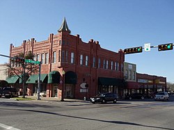 The Emporium Building at the intersection of Ennis Avenue and Dallas St. in Downtown Ennis.