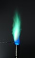 Exposed to a hot flame, which changes color to blue green indicates the presence of copper. Such elements are used to color fireworks.