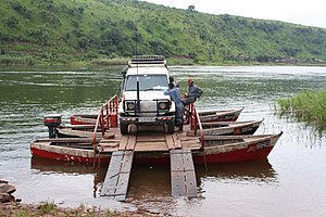Car being ferried across the Luvua River near Pweto