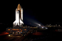 Space Shuttle Atlantis bathed in xenon lights STS-135 Atlantis rollout 1.jpg
