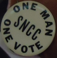 One man, one vote button which was probably worn at an SNCC event