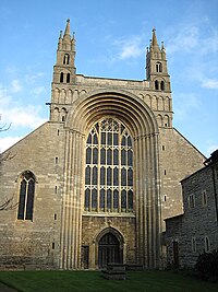 The tall Norman arch of the facade is unique in England Southwest face, Tewkesbury Abbey - geograph.org.uk - 1037447.jpg