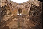 The base and muqarnas-carved squinches of the central dome in the covered section (the dome itself has been lost)