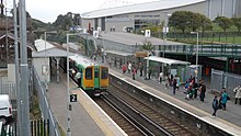 The adjacent Falmer railway station, with the Stadium visible in the backdrop. Brighton Falmer railway station in September 2013.JPG