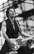 Bruce Springsteen performing with a guitar