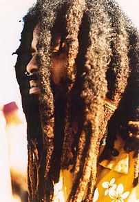 A man with dreadlocks.