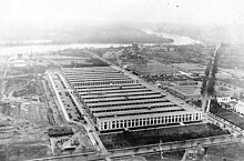 The main Navy Building (foreground) and the Munitions Building were temporary structures built during World War I on the National Mall. The Department of War was headquartered in the Munitions Building for several years before moving into the Pentagon. Mainnavy-munitions.jpg