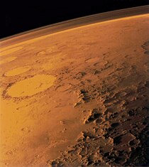 Mars's thin atmosphere, visible on the horizon in this low-orbit photo.