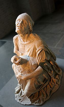 Ancient statue of a drunken old woman holding a jug of wine, 2nd century BC, Munich Glyptothek. Old drunkard Glyptothek Munich 437 n1.jpg