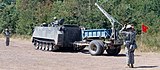 Soldiers Guide M113 to range to launch the M58 Mine Clearing Line Charge (MICLIC) at Fort Chaffee, AK, 19 July 2011.jpg