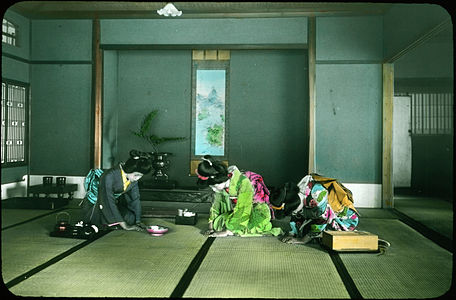 Three women with tea implements