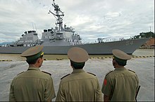 Vietnamese military officers watching the USS Curtis Wilbur preparing to dock at the port of Da Nang, July 2004 US Navy 040728-N-8796S-093 Vietnamese military officials watch as USS Curtis Wilbur (DDG 54) prepares to moor in the Vietnamese port of Da Nang.jpg