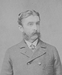 formal photo of a man about in his 30s with sideburns and moustache