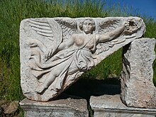 Stone carving of the goddess Nike at the ruins of the ancient Greek city of Ephesus