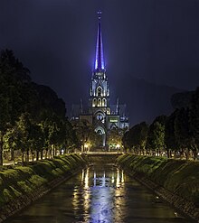 The tower of Cathedral of Sao Pedro de Alcantara in Petropolis, Brazil with its spire lit up in blue Petropolis Cathedral, Saint Peter of Alcantara Church, place of Emperor Pedro II, Brazil.jpg