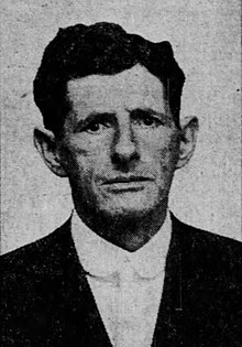 Black and white headshot of a man