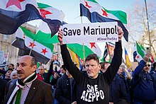 Demonstrations against Russian bombing of Mariupol by Syrian protestors in Central London, March 2022 Save Mariupol (51953062017).jpg