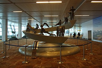 Sculpture depicting 12 asana's of Surya Namaskara A in Terminal T3 at IGIA Airport, New Delhi, India, created by Nikhil Bhandari. Surya Namaskar sculpture at IGIA T3.jpg