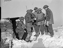 Men of the 2nd Battalion, Royal Norfolk Regiment receive their rum ration before going out on patrol in France, 26 January 1940. The British Army in France 1940 F2264.jpg