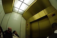 2015 photograph of the interior of one of the Otis Elevator Company-manufactured express elevators that serve the observation deck, The Signature Room, and Signature Lounge The John Hancock Observatory (16628953301).jpg