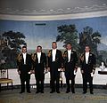 White House social aides pictured during the presidency of John Kennedy in the Diplomatic Reception Room