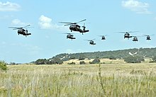 Formation of UH-60 Blackhawks with the 1st Cavalry Division Cav troopers conduct maneuver operations 140713-A-HD608-014.jpg