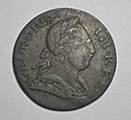 Obverse type 6: open, banded curaiss, three (?) small berries in wreath, older features, contoured cheek