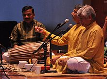 Gundecha Brothers (2012). Left to right: youngest brother Akhilesh Gundecha (Pakhawaj), younger brother Ramakant Gundecha (Vocal), elder brother Umakant Gundecha (Vocal)
