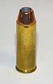 .45 Colt cartridge featuring a jacketed hollow point bullet