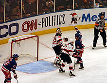 Sean Avery of the New York Rangers attempts to distract Brodeur during the 2008 Stanley Cup playoffs. The playoff series was the fifth to feature the Devils-Rangers rivalry. Averyrule.jpg