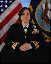 A female U.S. Navy officer in Service Dress Blue uniform (2012) CDR Michele Day, USN (X.O.).jpg