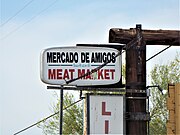 Mercado de Amigos Meat Market sign