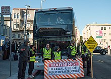 San Francisco activists protest privately owned shuttle buses that transport workers for tech companies such as Google from their homes in San Francisco and Oakland to corporate campuses in Silicon Valley. Google bus protest.jpg
