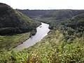 Poliʻahu Heiau view of Wailua River, Kamokila Hawaiian Village (at right), and Fern Grotto tour boat