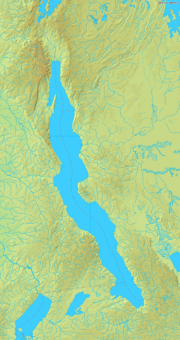 Long rift lake with outflow to Congo River in the middle of western shore.