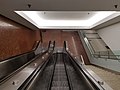 Escalators and stairs leading from the plaza level to the lobby level (left) and mall (right)