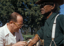 Researcher collecting a blood sample as part of the Tuskegee Syphilis Study Tuskegee-syphilis-study doctor injects subject with placebo.gif