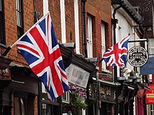 Union Jacks on two flagpoles hanging off of a building in Surrey, 2012 Union Jacks in Godalming - geograph.org.uk - 3028373.jpg