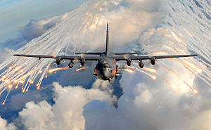 A Lockheed AC-130U Spooky releasing decoy flares.