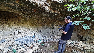 Trash left by antiquities thieves at the site