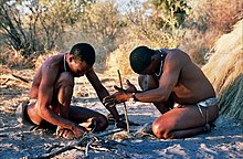 Starting fire by hand, San people in Botswana. BushmenSan.jpg