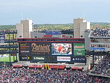 Scoreboard in Gillette Stadium, near Boston, in 2007 with multiple sponsor logos visible Gillette Stadium03.jpg