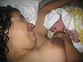 Woman giving birth at home