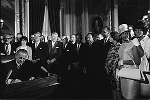 English: President Lyndon B. Johnson signs the...