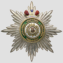 Jeweled and enamel honor in the shape of a star with a crown on the top
