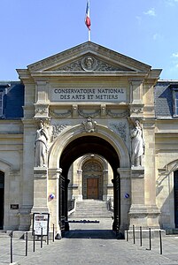 Pair of Neoclassical caryatids at the entrance of the Conservatoire national des arts et métiers (Rue Saint-Martin no. 292), Paris, unknown architect, mid-19th century