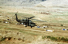 A U.S. Army Black Hawk flies over a small village in the Kurdish occupied security zone in Northern Iraq during OPC ProvideComfortBlackHawkvillage.jpg